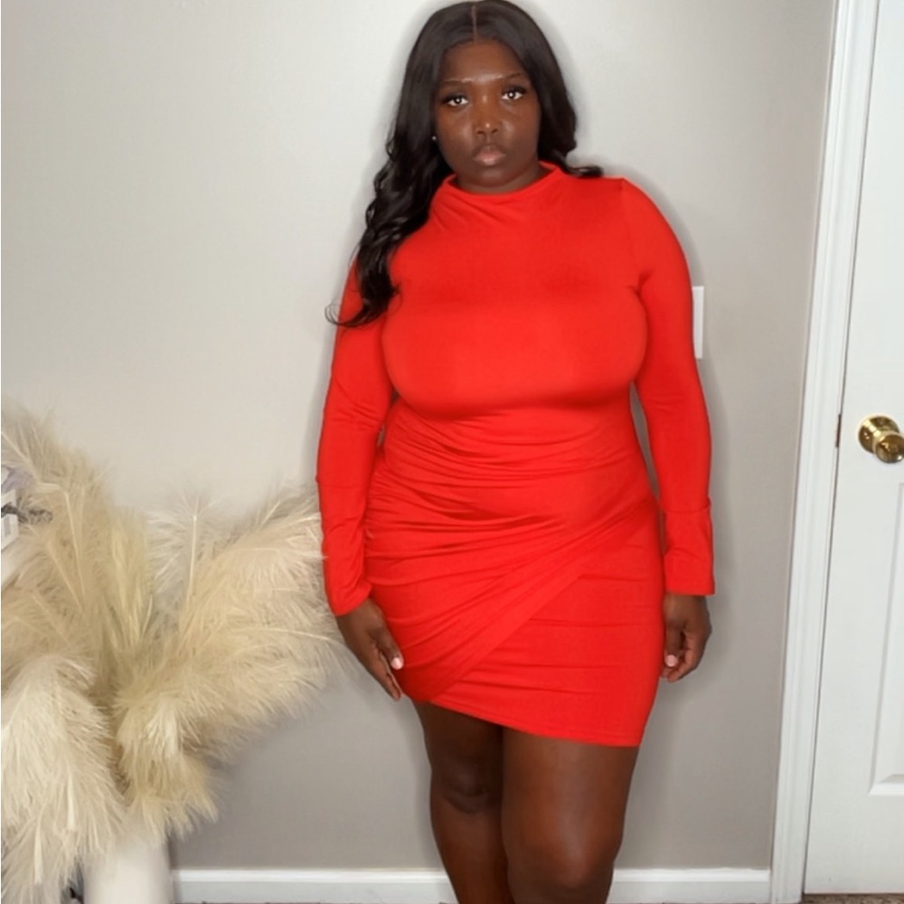 Red fitted long sleeve high neck dress.